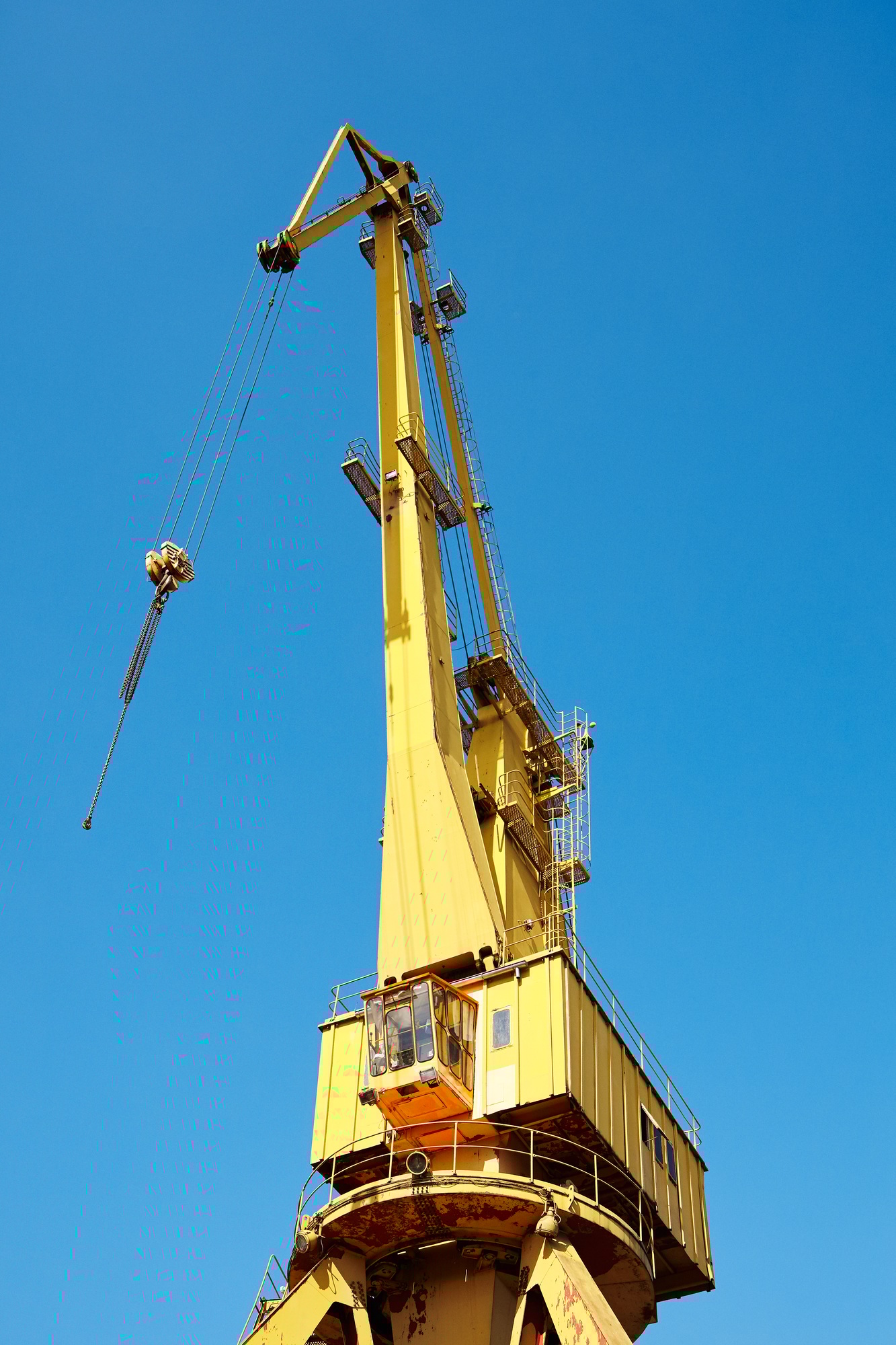 Yellow crane in a shipyard.